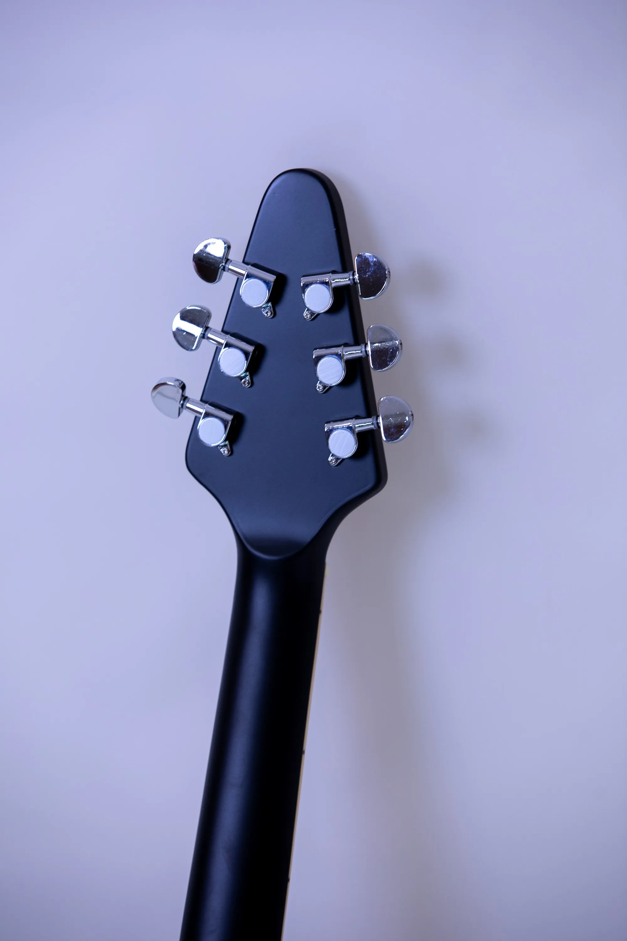 Customizable, factory direct, matte black 22-fret Okouman electric guitar, rosewood fingerboard, in stock.