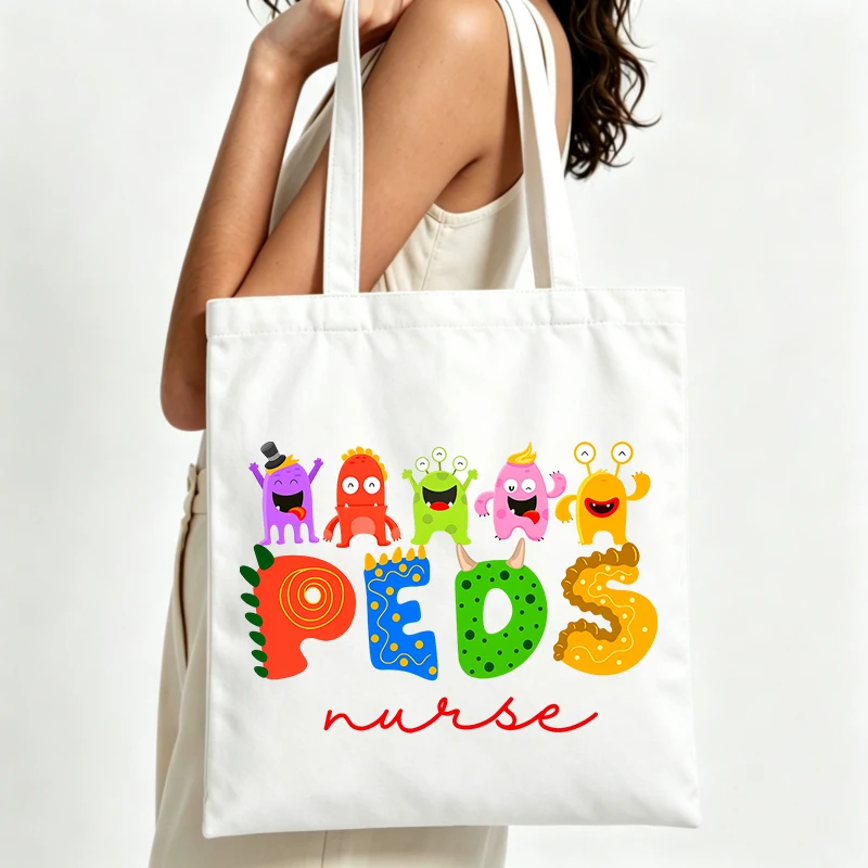 Pediatric nurses' canvas tote bag with colorful monster and letter print, ideal for casual daily use and work shifts