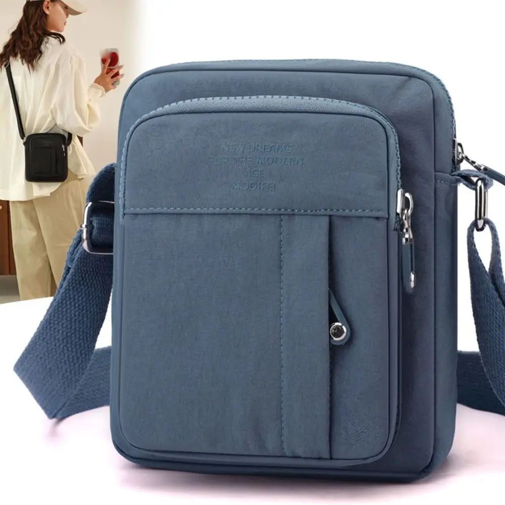 حقيبة كتف كاجوال من النايلون بلون سادة متعددة الطبقات خفيفة الوزن في منتصف العمر على الطراز الكوري حقيبة كروس متعددة الجيوب يوميًا