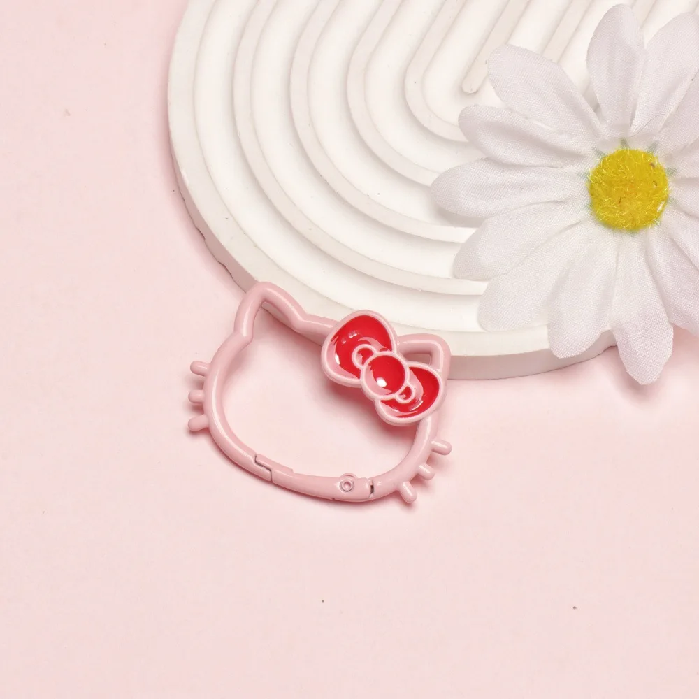 Miniso candy color paint hollow bow cat spring buckle color open spring coil metal hanging buckle accessories