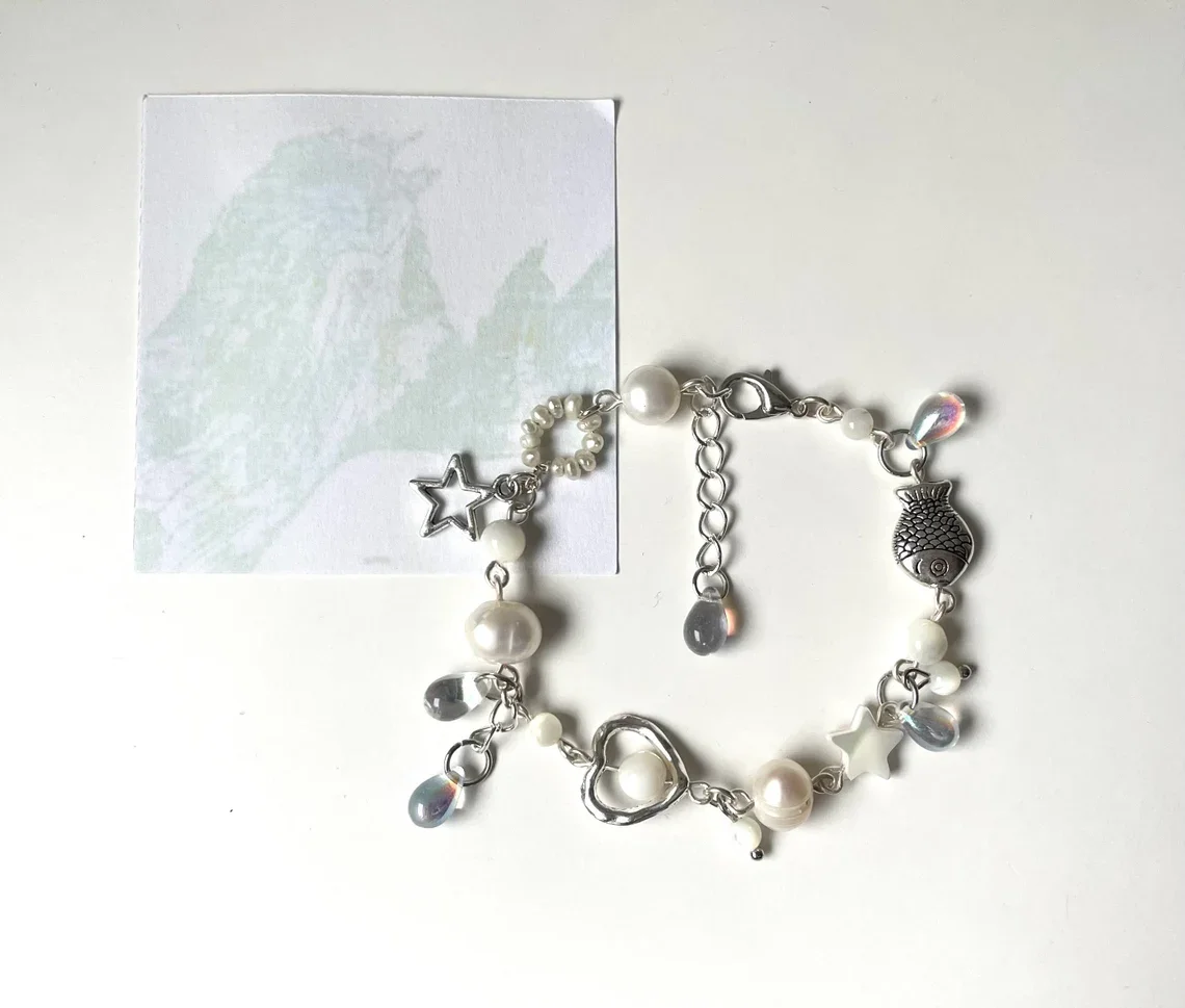 wave to earth bracelet | flaws and all | handmade beaded bracelet | white jewelry | w2e merch