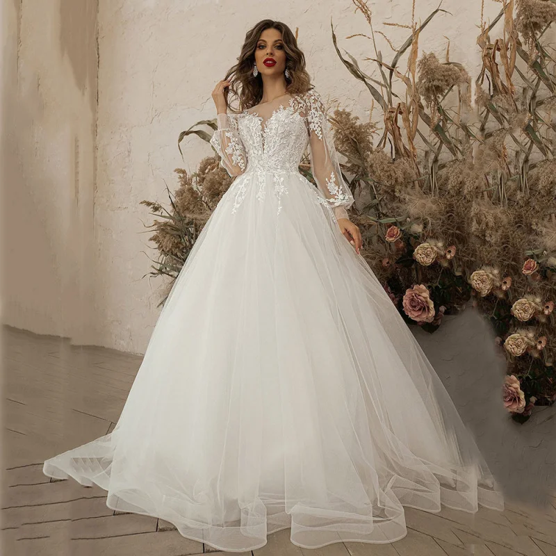 

High-end summer wedding dress with a long train, sexy sheer fabric, off-the-shoulder design, and puffy long sleeves