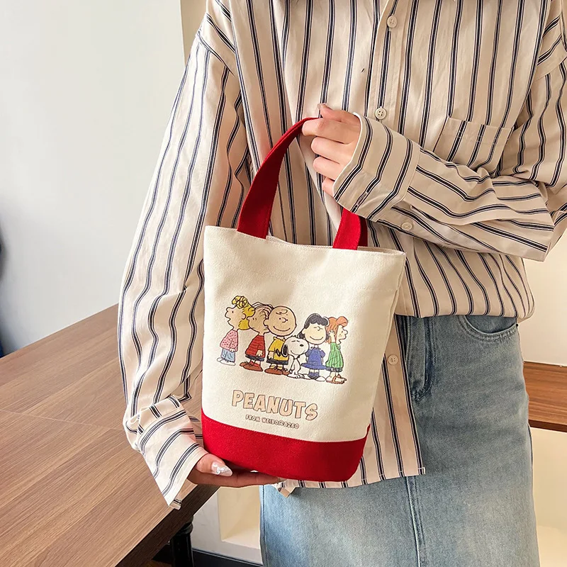 

2024 New MINISO Kawaii Anime Snoopy Handbag Women's Fashion Large Capacity Bucket Bag Printed Canvas Bag Leisure Shopping Bag