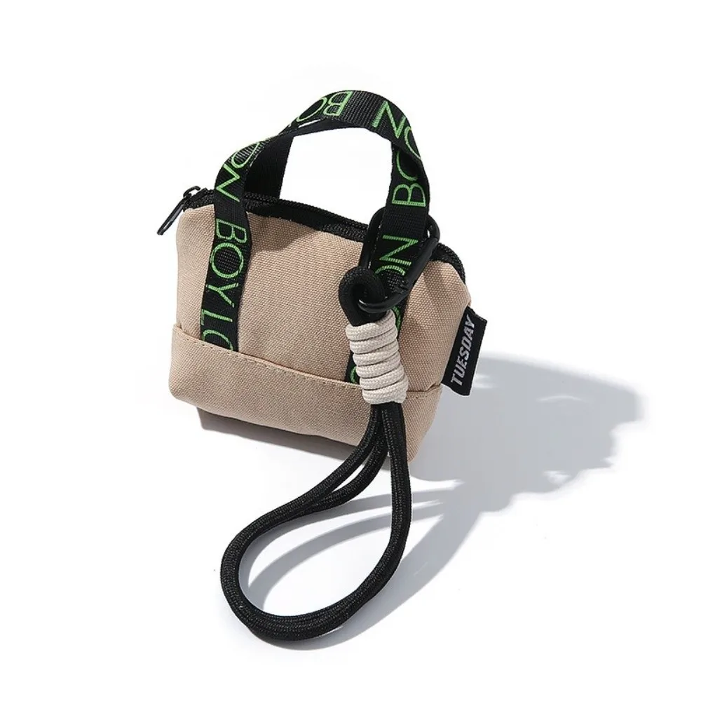 محفظة نقود معدنية صغيرة جديدة من القماش مع سوار معصم لسماعة الأذن وحامل بطاقات وردي من Dopaamine