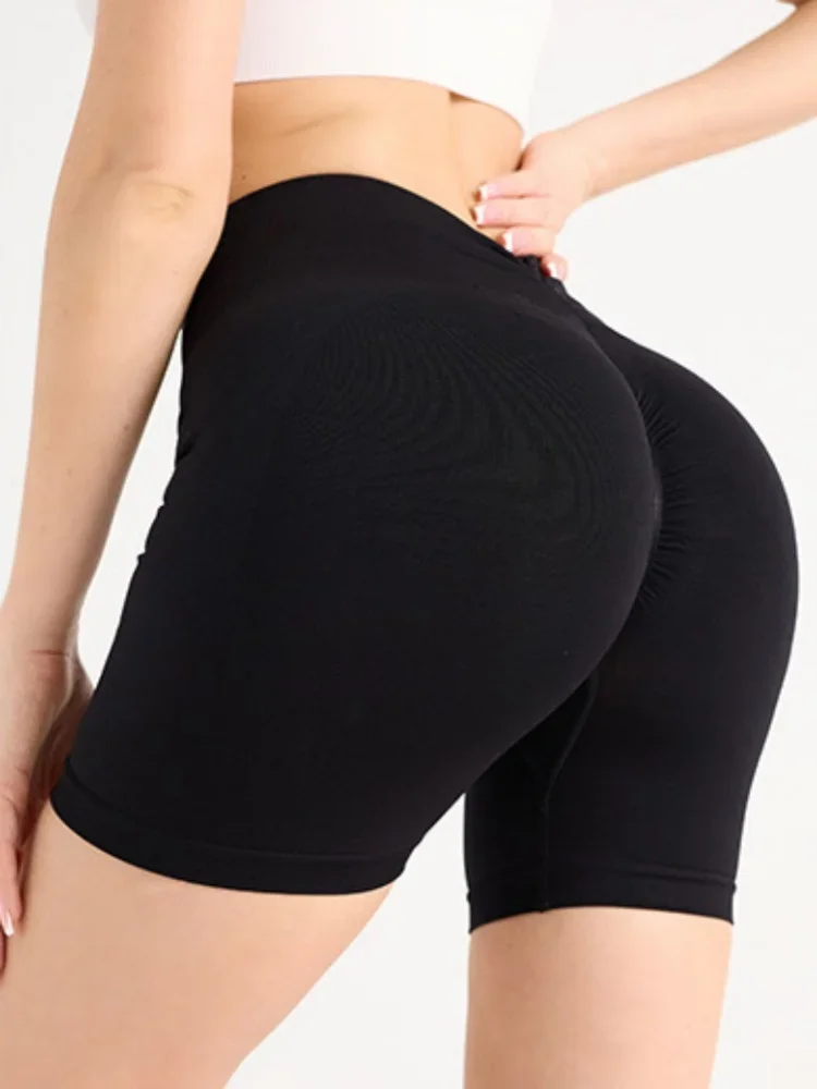 Shorts de ioga apertados para exercícios de secagem rápida com quadril pêssego sem costura