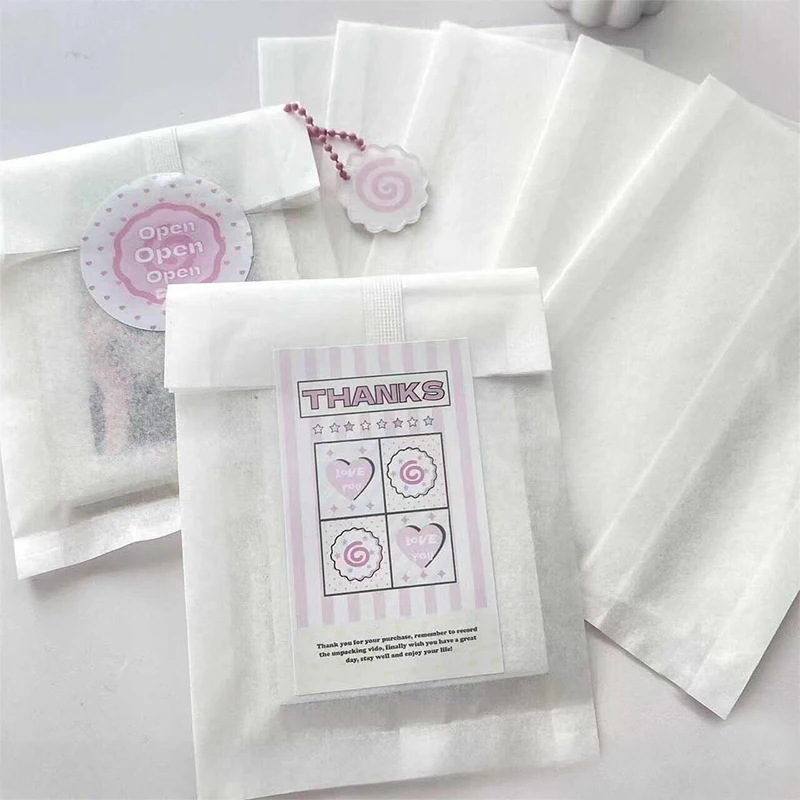 100pcs White Paper Jewelry Packaging Bags Strip Seal Semi-transparent Halloween Christmas Party Favors Gift Pouches Supplier