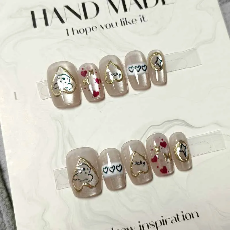 10 ชิ้นน่ารักการ์ตูนหัวใจสีทองและสุนัขกดบนเล็บสไตล์ฝรั่งเศส Polka Dot Bowknot เล็บที่ถอดออกได้ Cat Eye Design เล็บ