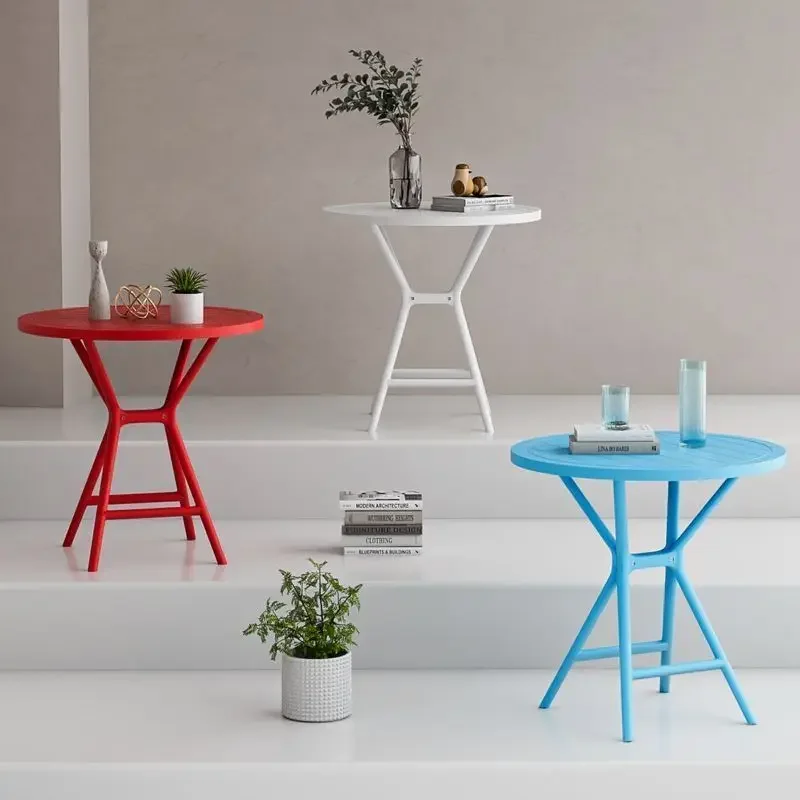 a Modern Round Outdoor/Indoor Bistro Table with Geometric Legs, Weather-Resistant Dining Table for Patio, Balcony & Small Spac