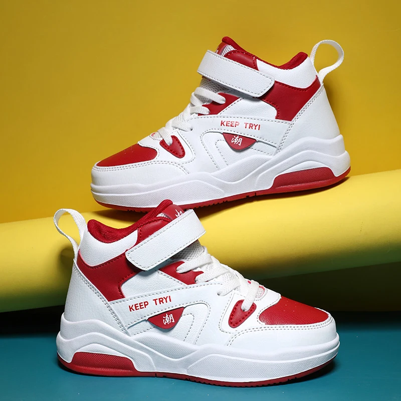 A pair of children's sports shoes with anti-slip soles, ankle support, and a design featuring Velcro fastenersYZ-1688