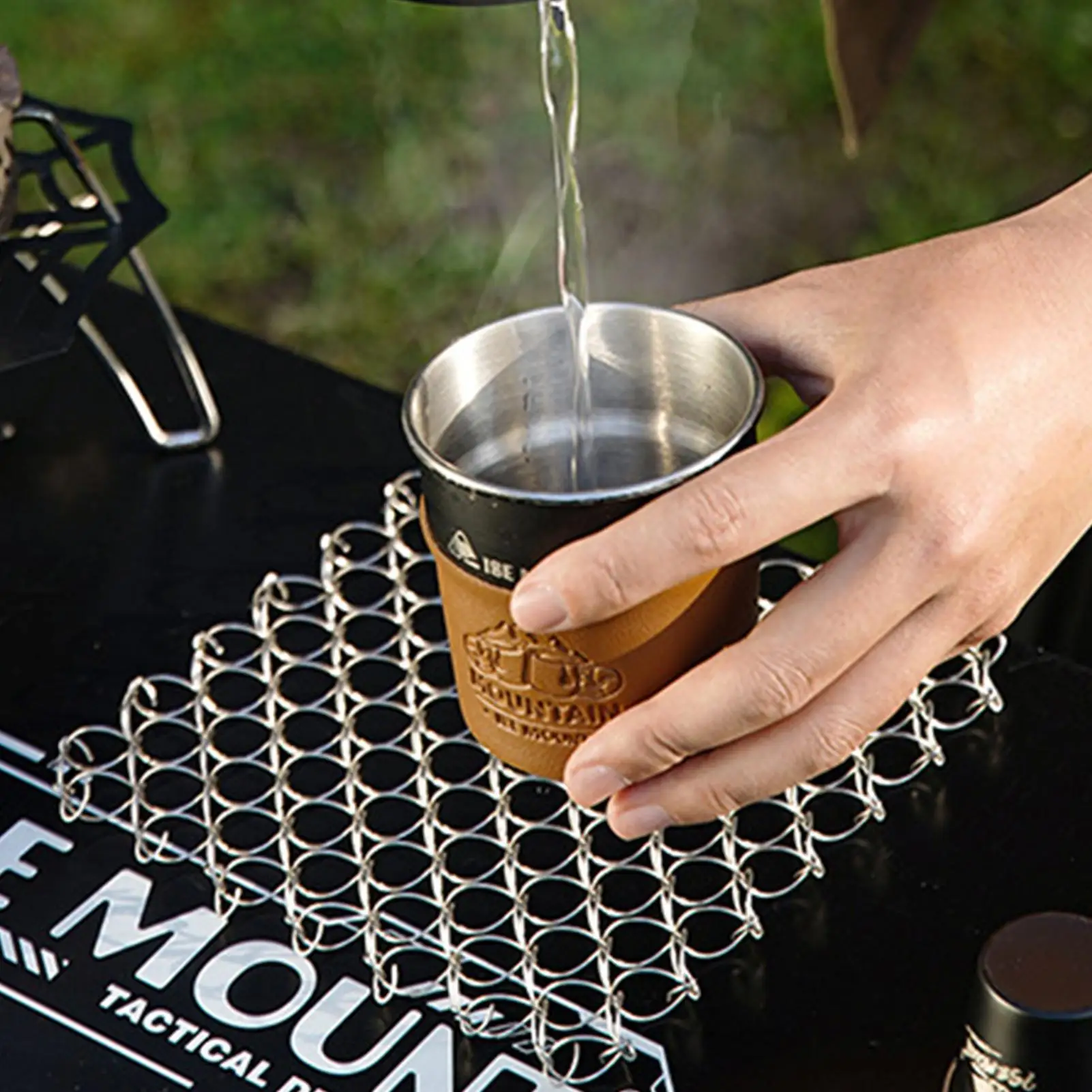 أدوات المائدة بساط معزول الربيع مكافحة تحرق وسادة سلك حلزوني الركيزة العزل الحراري وسادة أدوات مائدة من الفولاذ المقاوم للصدأ حصيرة للتخييم