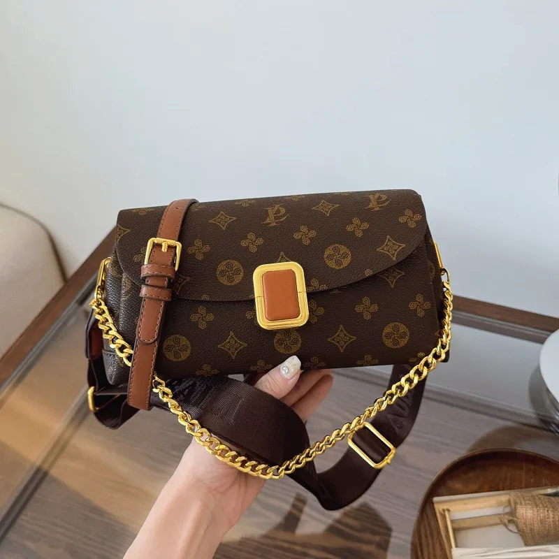 

Elegant Crossbody Bag By Luxury Brand Featuring Soft Leather, Adjustable Chain Strap and Compact Size Perfect for Evening Events