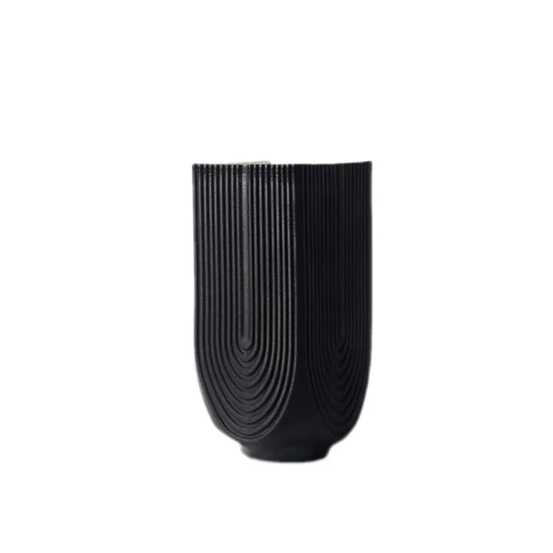 

Modern simple 3D ceramic black and white vase, soft flower arrangement at the sales office of the home model room