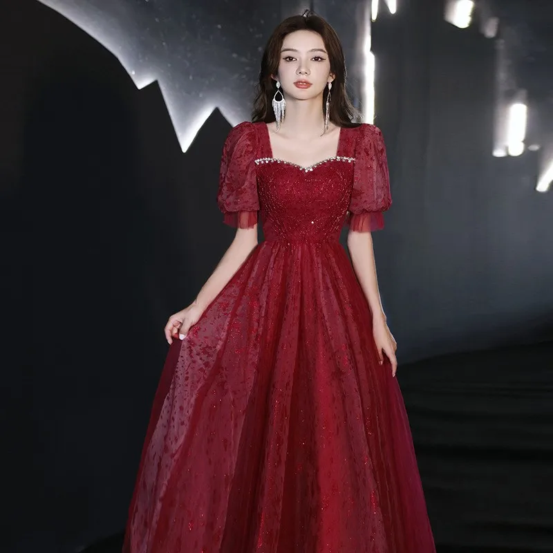 

A new and stylish casual dress in wine red for toasting