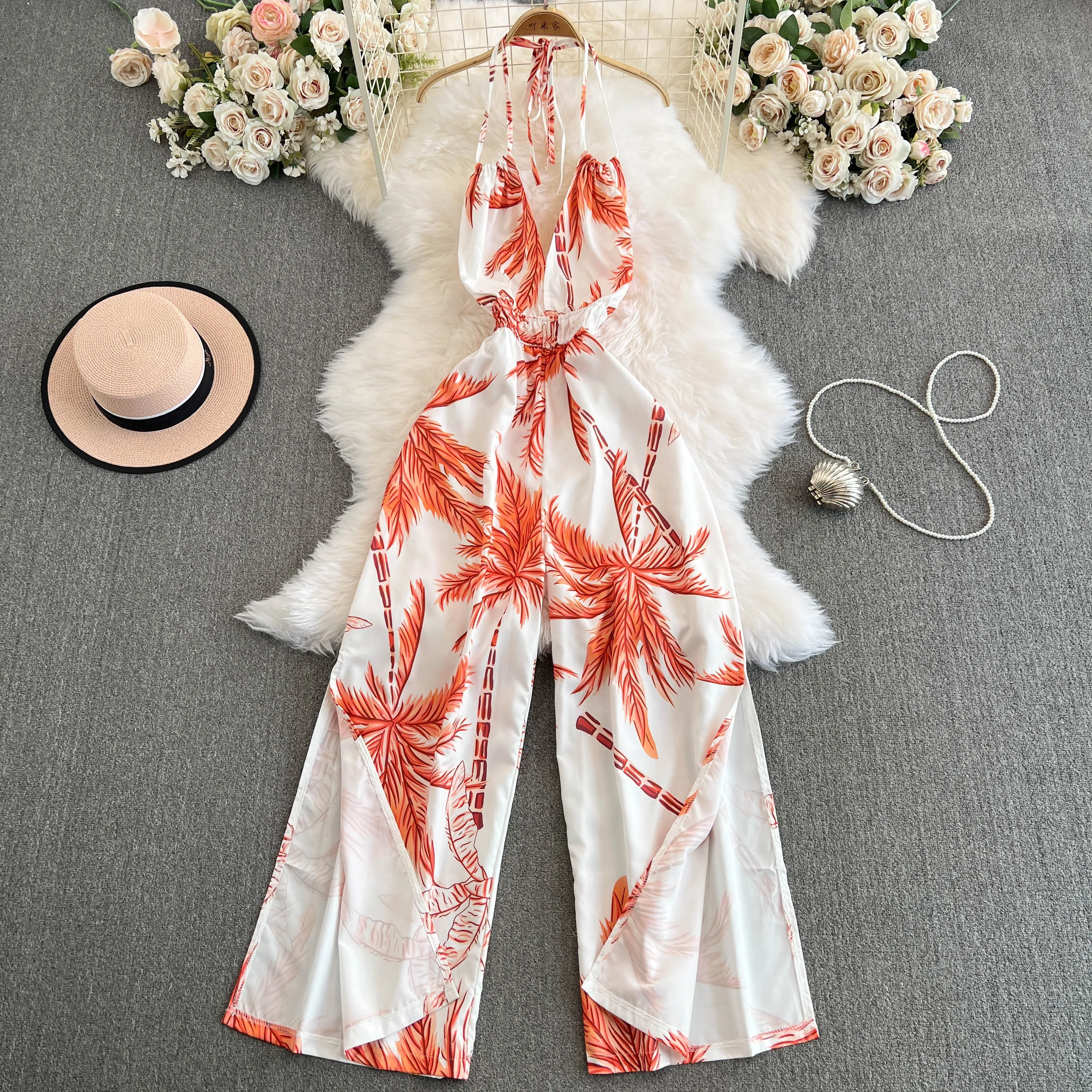 

Foamlina Bohemian Vacation Style Printed Hanging Neck Backless Jumpsuit for Women Casual Loose Fit High Waist Wide Leg Pants