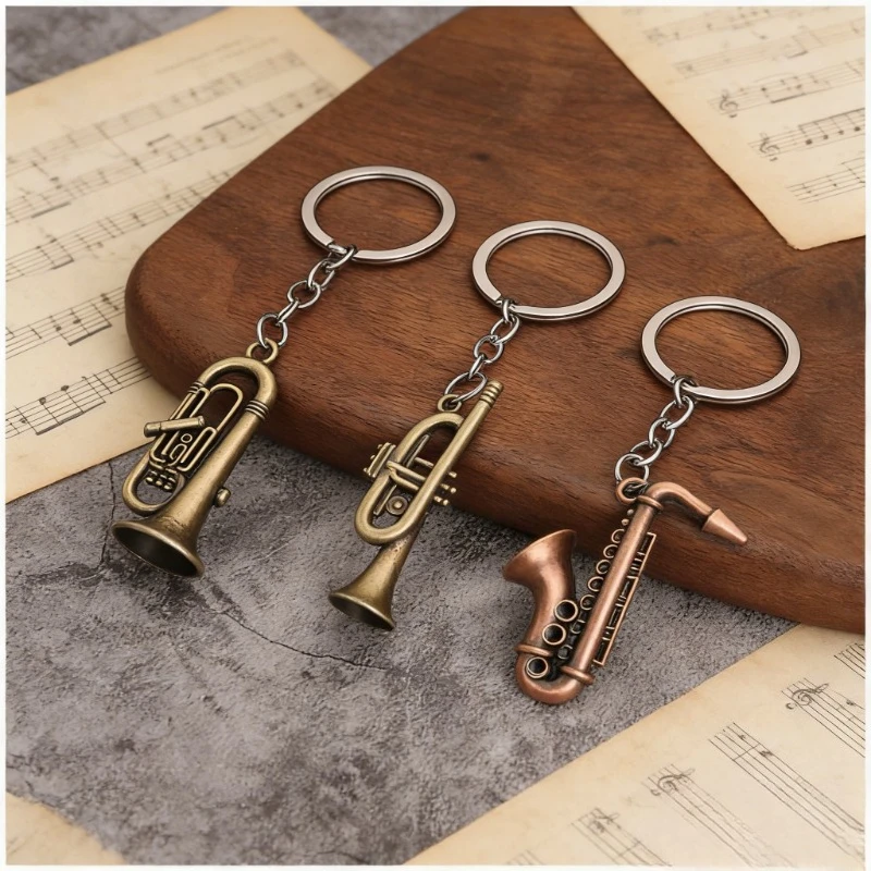 Nouveau porte-clés mini rétro en métal en forme de saxophone, petit cadeau musical tendance pour hommes et femmes