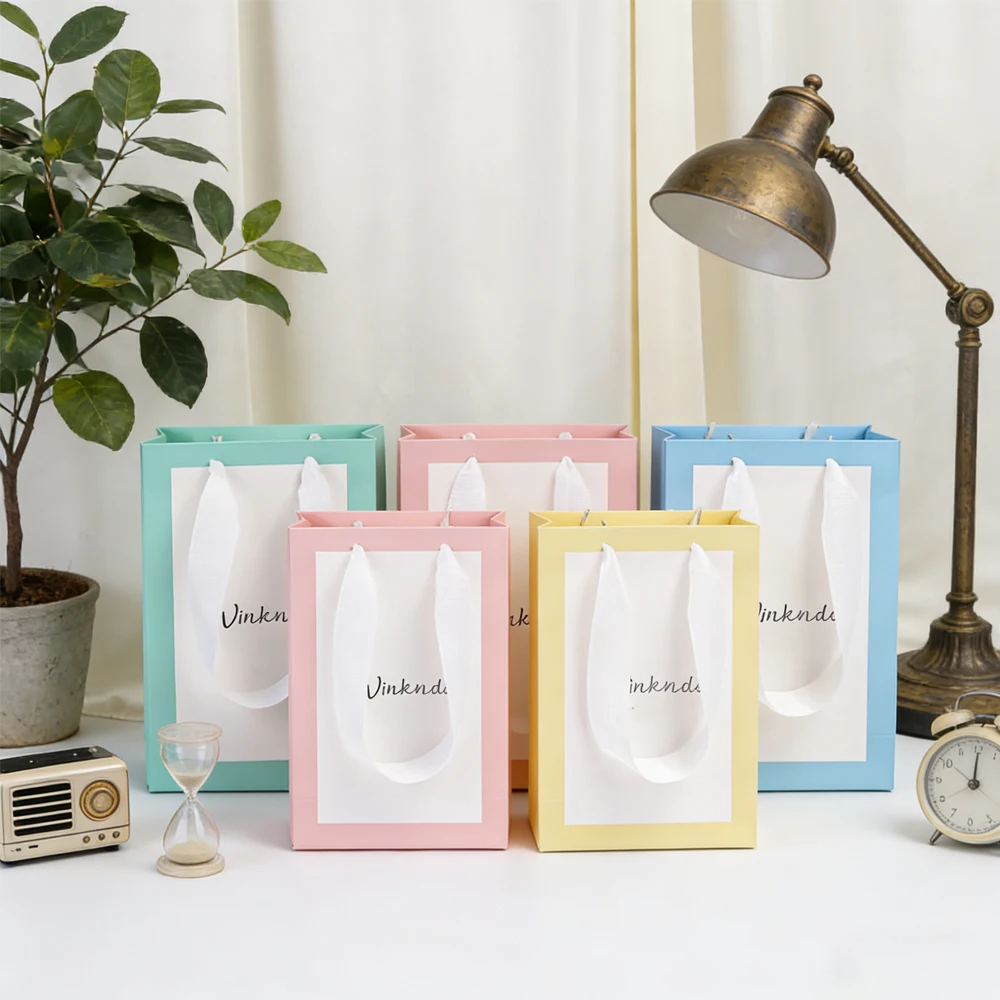 

Customized Logo White Kraft Paper Tote Bags Clothing Shipping Supplies for Packing Wedding Christmas Gift Packaging Pouches Box