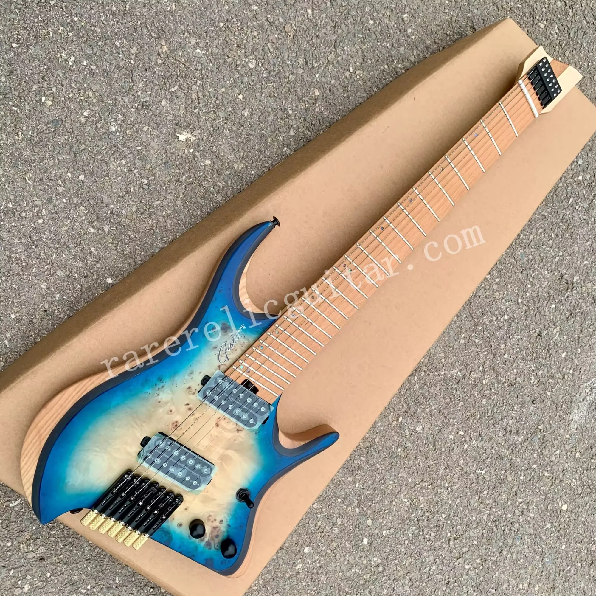 

Headless Electric Guitar, Fanned Frets, Spalted Maple Top, Ash Body, Black Rosewood Center Panel