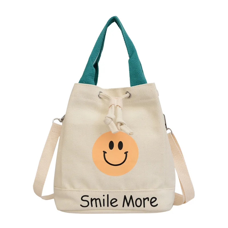 Nuova borsa di tela con viso sorridente borsa da donna alla moda borsa a secchiello retrò europea e americana borsa a tracolla Casual all\'ingrosso