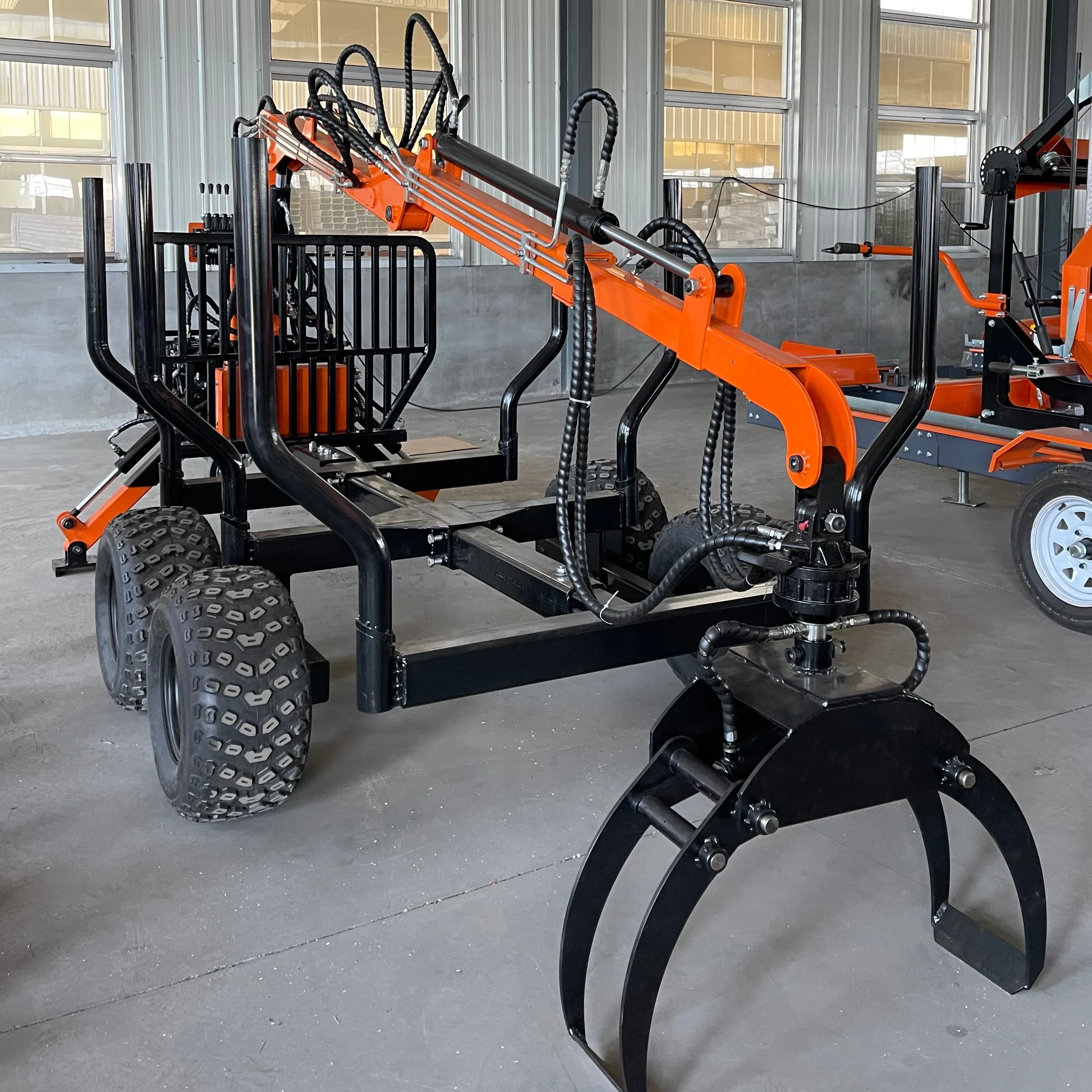 Timber trailer with manual crane for retrieving logs in timber or sequestered areas