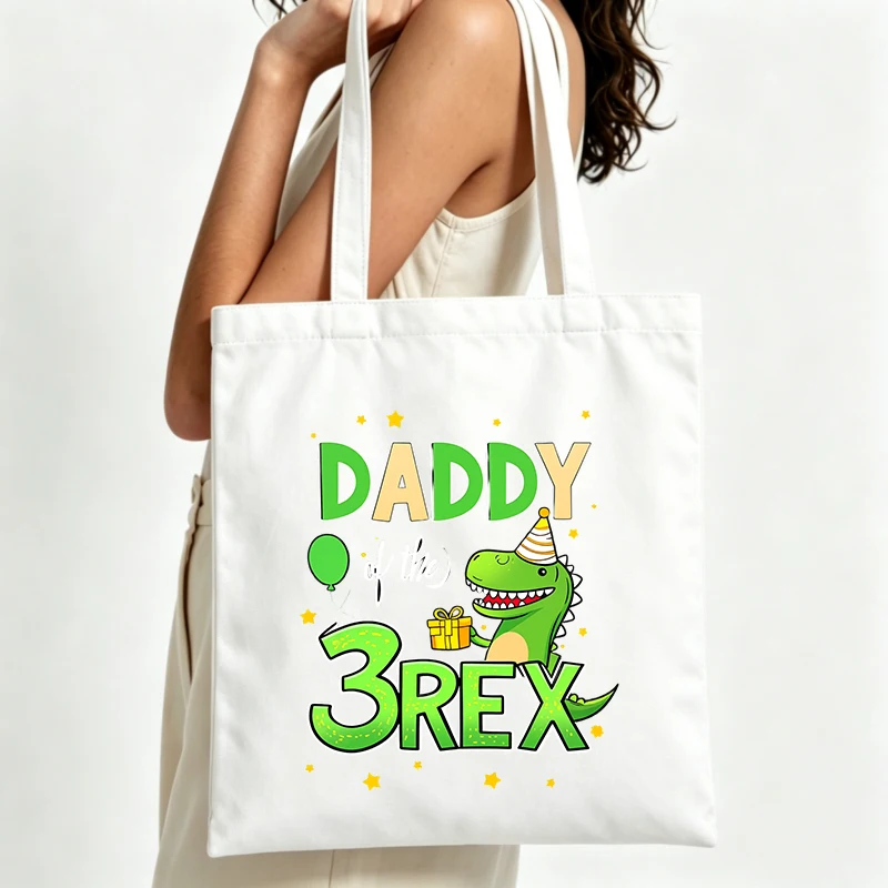 Women's dinosaur graphic canvas tote bag with letter print, perfect for casual daily use and birthday celebrations
