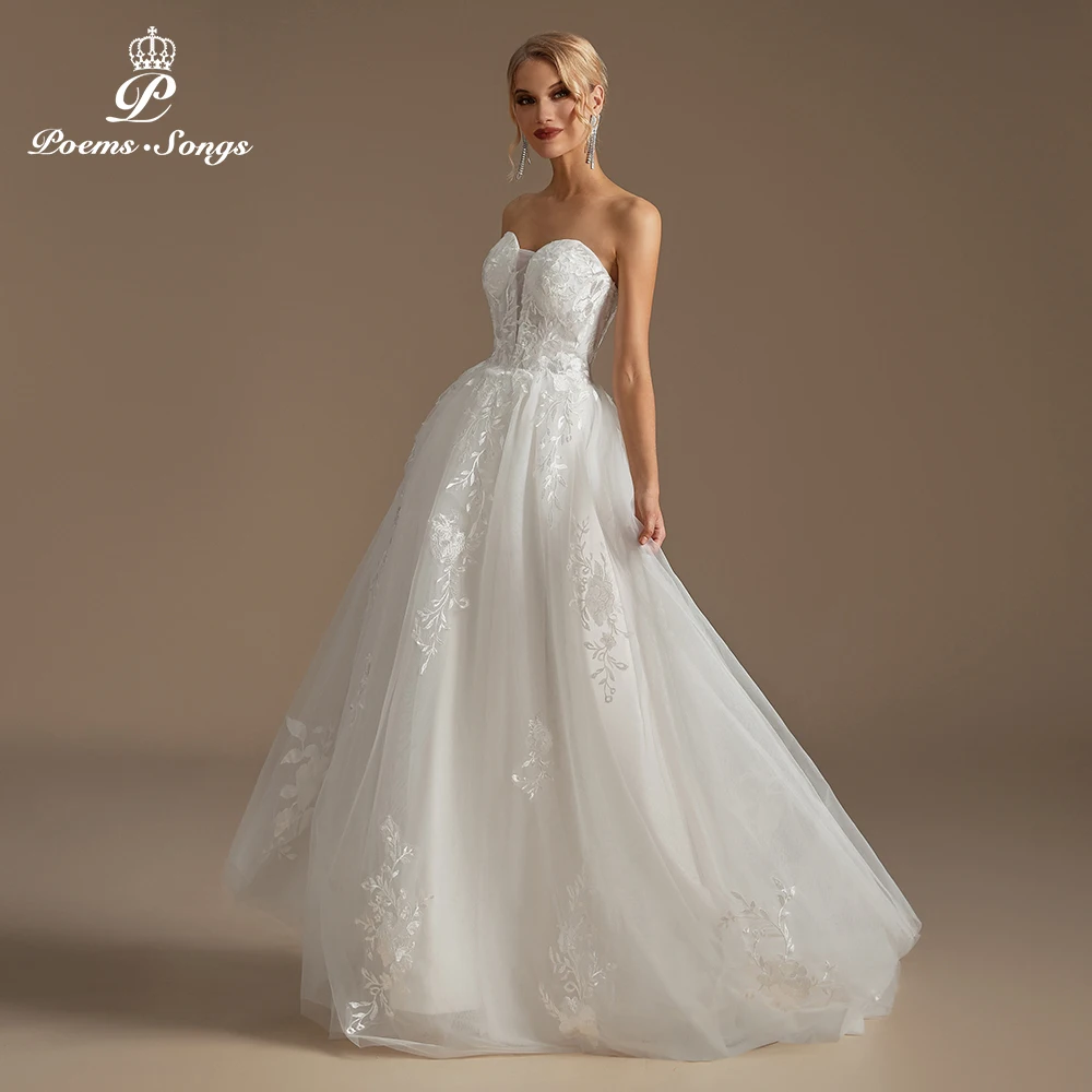 Romantic Strapless Wedding Dress with Floral Appliques Featuring Floral Embroidered Details for a Dreamy Wedding