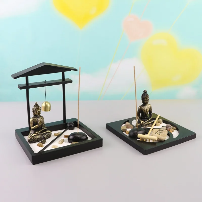 Zen tori garden atmosphera with stones, candle holder, gong and sand for meditation and decoration