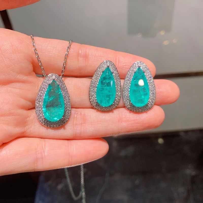 

European and American retro-style fashion green gemstone pendant necklace, earrings, and ring set for women in teardrop shape