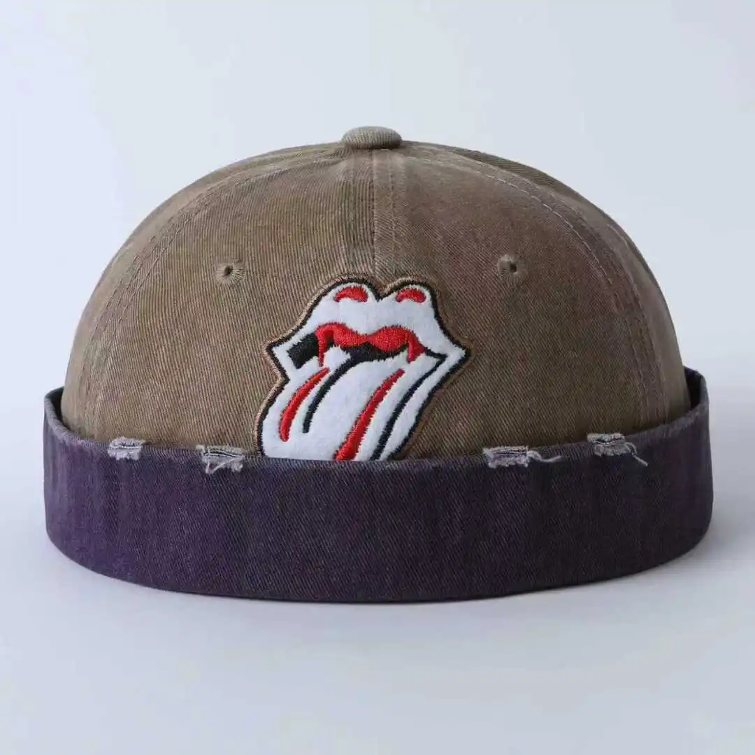 Japanese-style cool guy style multi-color brimmed hat with frayed holes, embroidered lips, lettered bottom, and a master's hat.