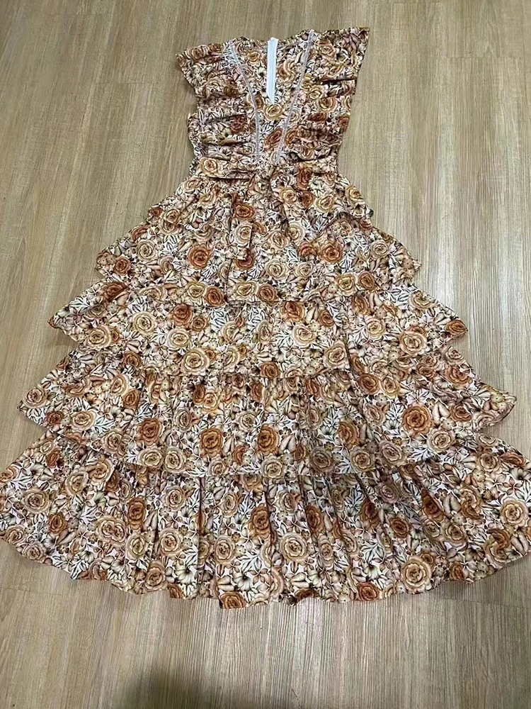 2025 zomer damesjurk met V-hals, holle sticker, flens, vliegende mouwen, vetersluiting, hoge taille, losse geplooide pommelrok met meerdere niveaus