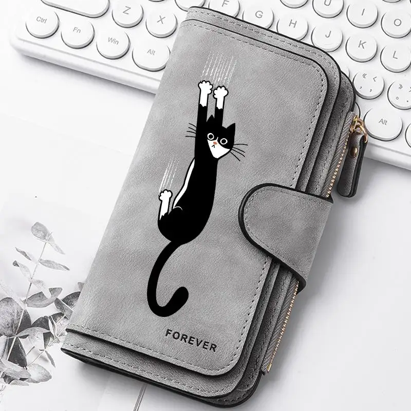 Featuring a cat motif this women's long wallet offers multiple card slots a coin pocket and a cell phone pouch A perfect gift