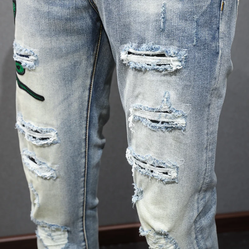 جينز Ashion Men'sy2k مع ثلاثة رؤوس بنمط ثعبان مرن وقابل للتمدد بقصة ضيقة مغسول باللون الأزرق الفاتح للرجال الهيب هوب ريت