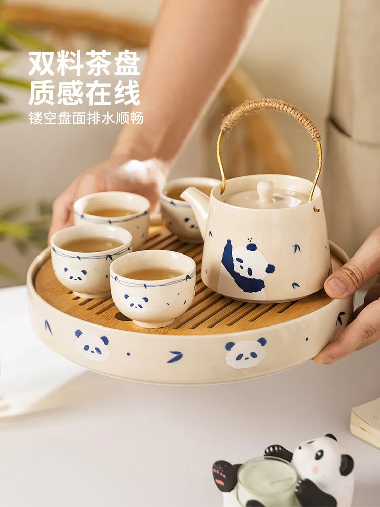 Making teapot, surrounding stove, making tea, household young people's tea set, one person drinking teacup