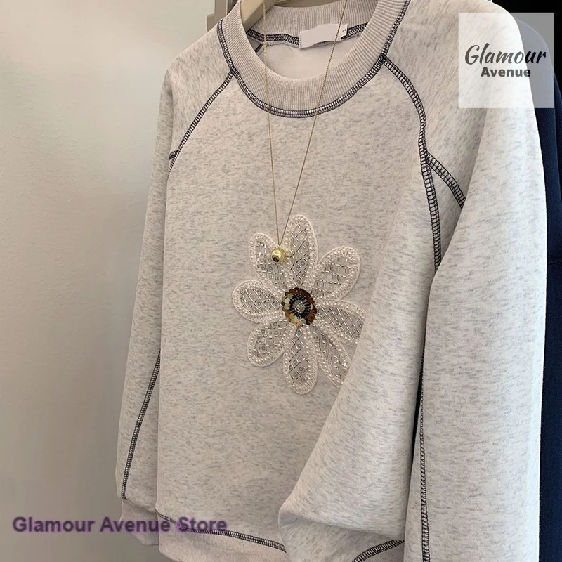 American retro open line applique design sense pullover sweater women's autumn and winter new thick little casual Joker top.