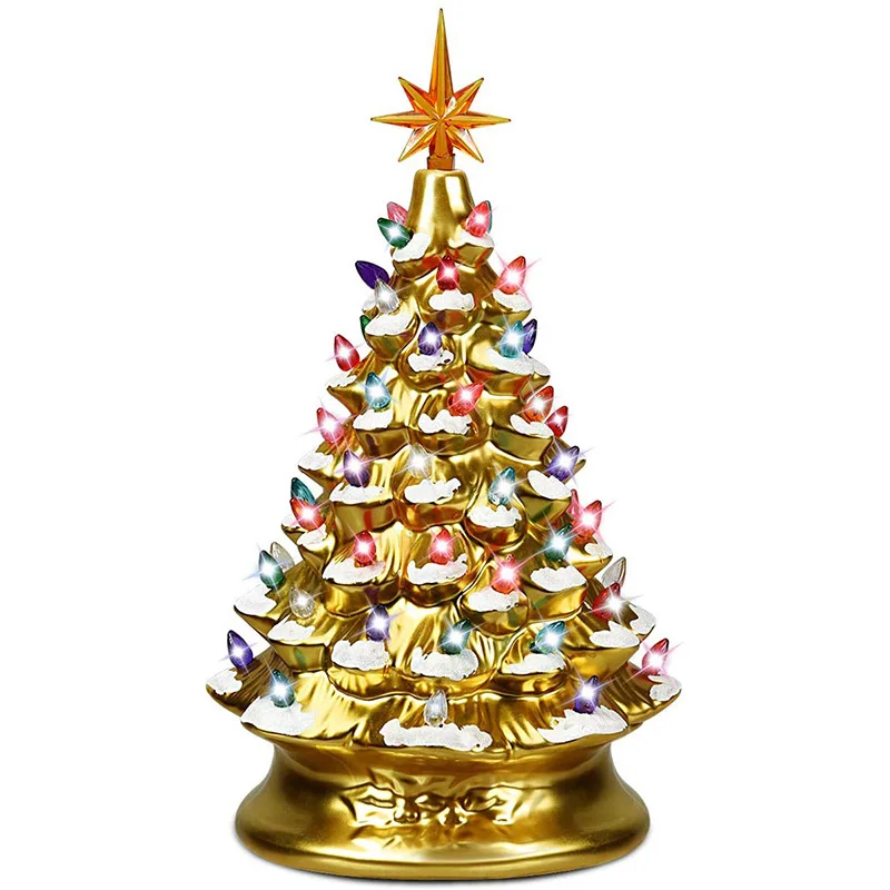 

Golden and silver resin Christmas tree with snowflakes and glowing colored lights - a festive table decoration piece