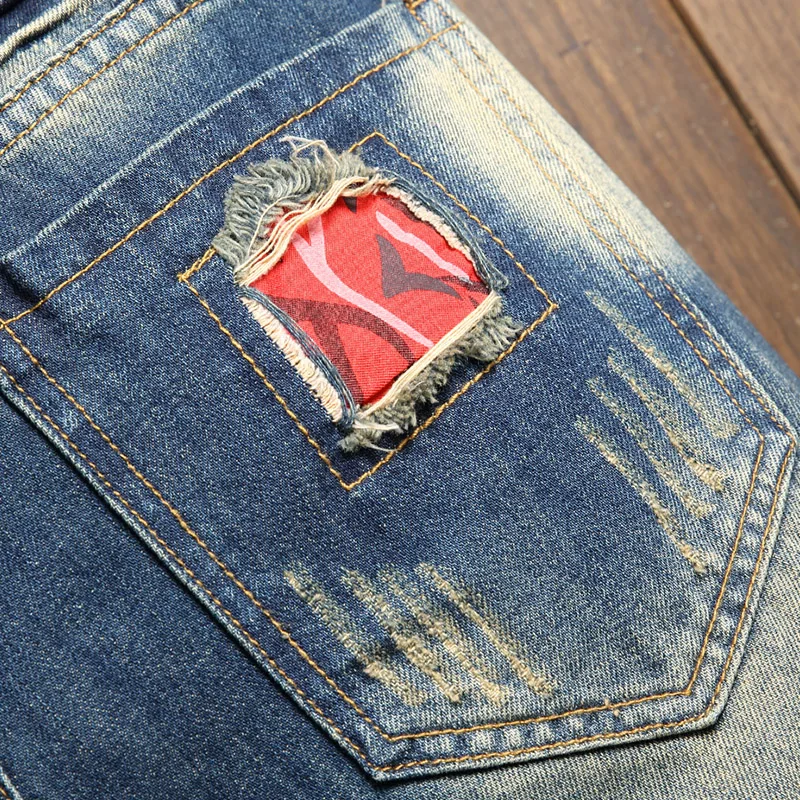 2025 Pantaloncini di jeans strappati estivi da uomo con giunture larghe al ginocchio Jeans corti casual Personalità Streetwear Hip Hop Abiti maschili