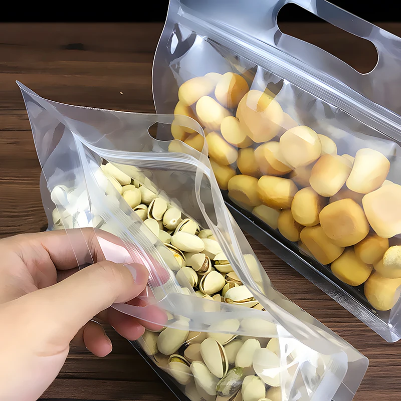 50pcs Factory Wholesale Zipper Top Self Sealing Clear Flat Bottom Pouch for Nuts Spice Plastic Food Packaging Bags with Handle