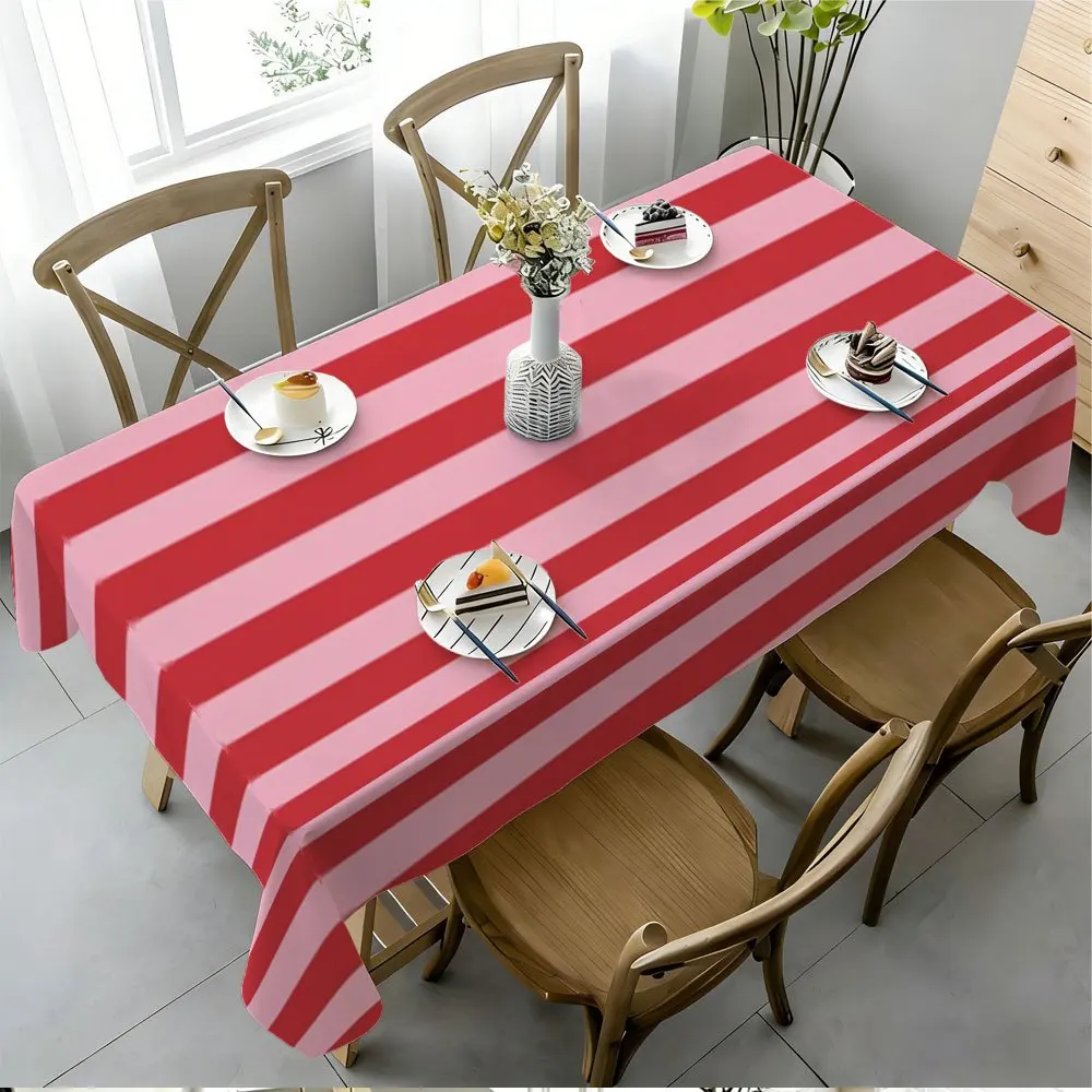 A creative tablecloth with alternating pink and red stripes, made of durable polyester fabric.