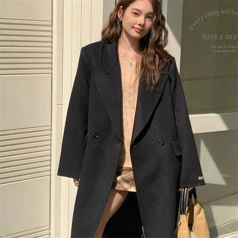 2026 Cappotto di lana con petto abbassato da donna autunno 2026 Moda stile sciolto Abbigliamento invernale da donna Cappotti lunghi Top