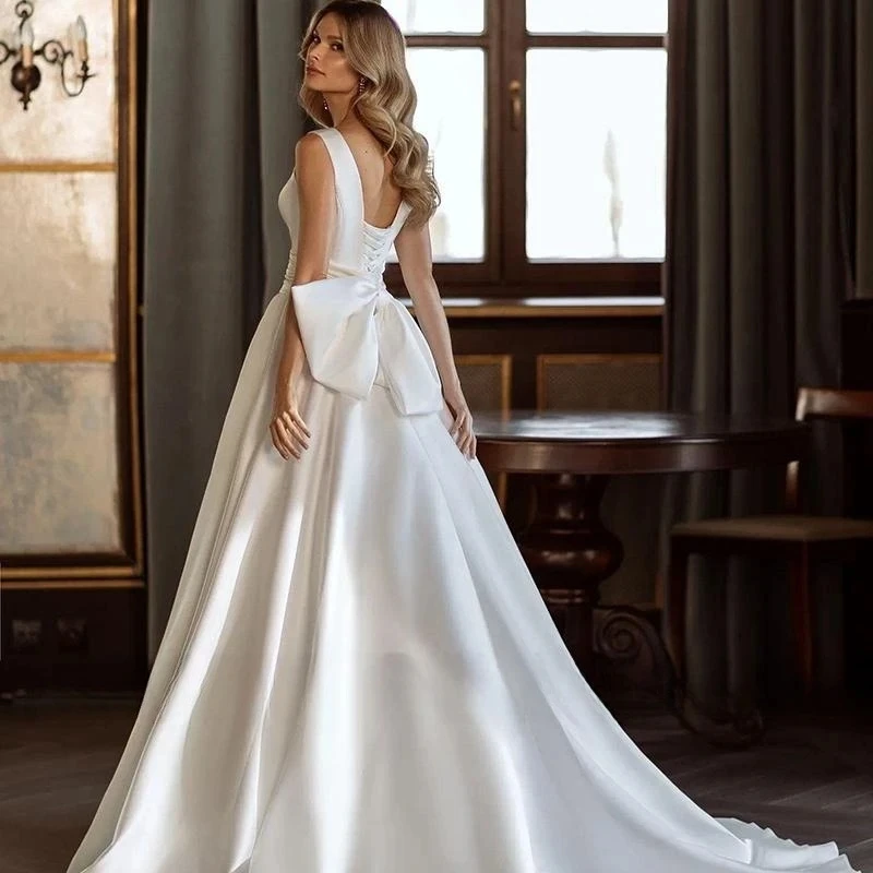 Abiti da sposa di moda moderna abiti da sposa in raso lucido fiocco decorare abito semplice con scollo a v Backless senza maniche Vestidos De Novia