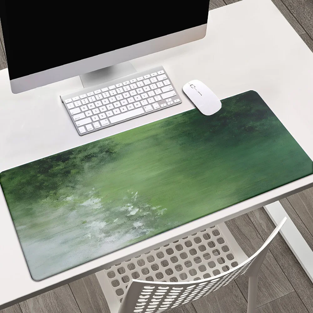 

XXL green paint pattern mouse pad with high-definition printing and anti-slip rubber base, suitable for gaming and office use