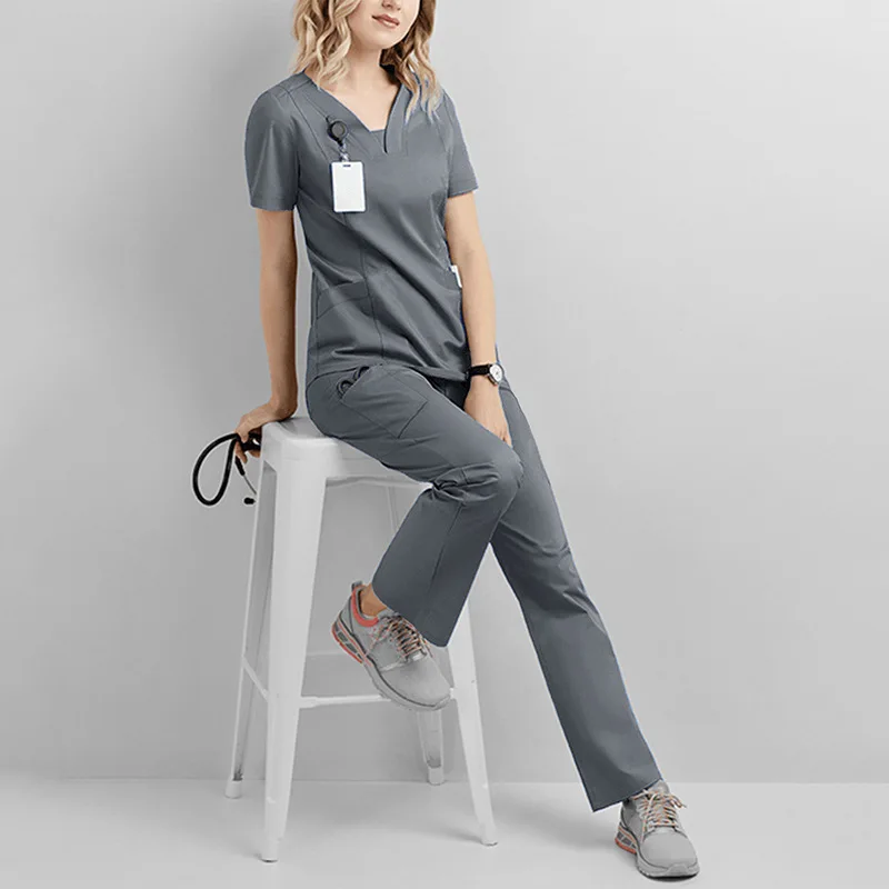 

2024 New Fashion Scrub Suits Dental Hospital Uniform Set Solid Color Unisex Surgical Gown Pocket V-Neck Scrubs Sets For Women