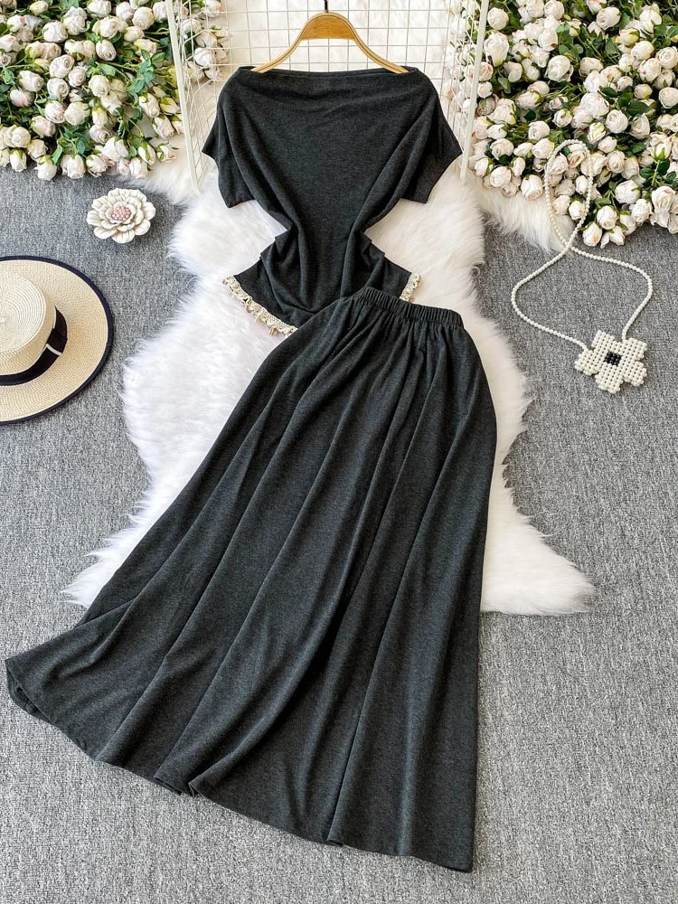 

2025 New High Waist Slim Fit T-irt Knitted Set with f Skirt One oulder One Neline ort Sve High Waist Knitted Set