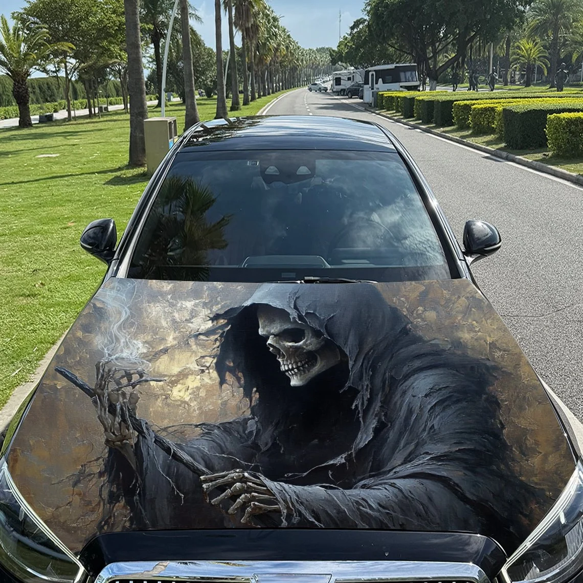 

Grim Reaper design on car hood, featuring a skeletal figure in dark robes holding a staff, set against a smoky, textured backgro