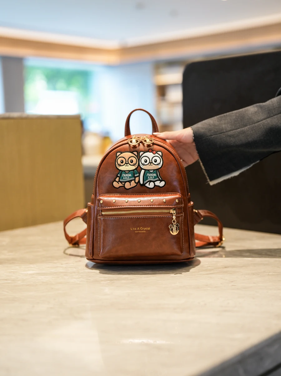 

Faionable Versatile Large Capaci Women's Bapa Commuter Travel Bear Bookbag Dual oulder Bag Korean Sle 2025 New Model