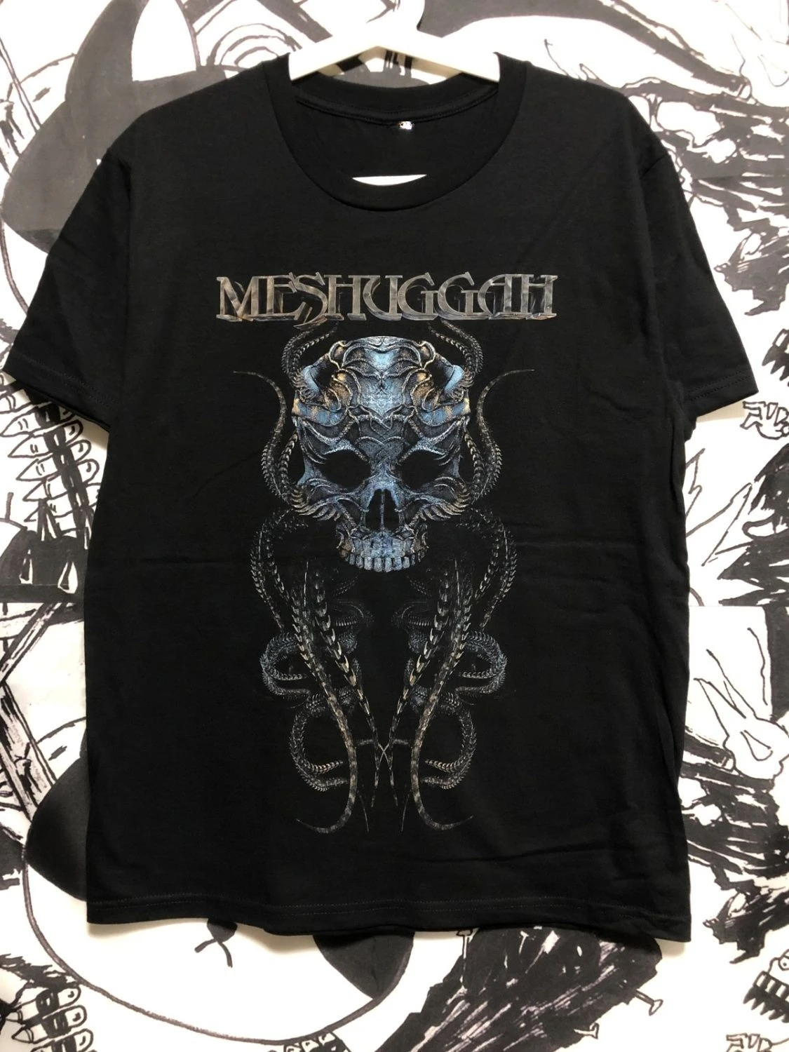 

Metallic Rock Printed Pure Cotton T-shirts for Men and Women By The Swedish Band Meshuggah, The Originator of Djent