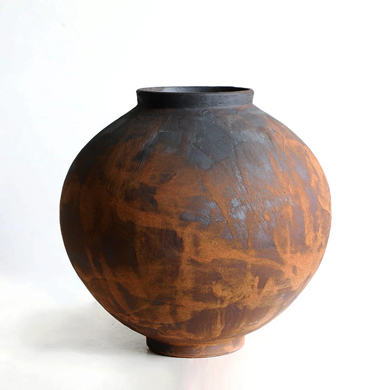 Retro, nostalgic, minimalist, modern, and tranquil style brown rough pottery jars, flower ware, and decorative decorations