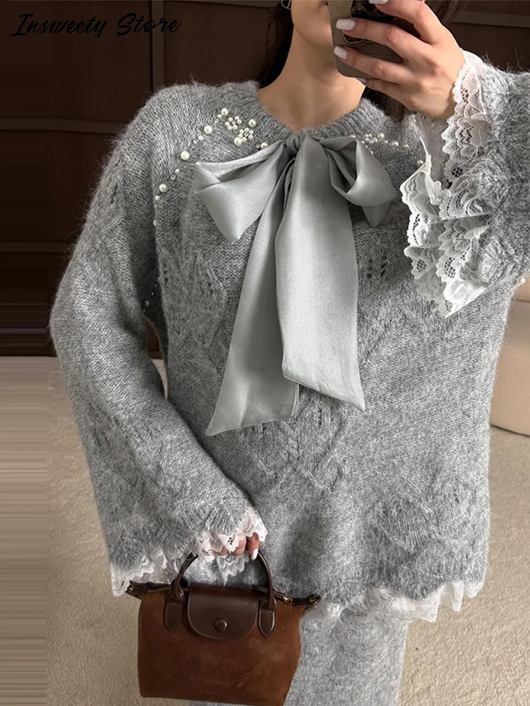 

Элегантный комплект свитера с кружевной отделкой, женские вязаные пуловеры с круглым вырезом и длинными рукавами с бантом, юбки до щиколотки, весенняя женская мода 2026, наряд