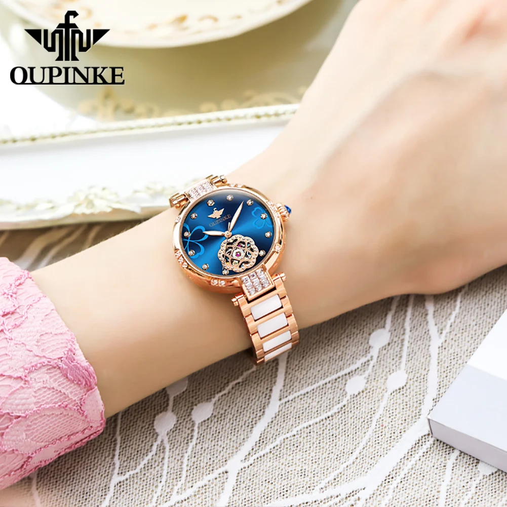 OUPINKE 3183 ساعة سيدات أصلية فاخرة أنيقة الهيكل العظمي ساعة ميكانيكية 50 متر مقاوم للماء تاريخ اليوم ساعة للنساء السيراميك
