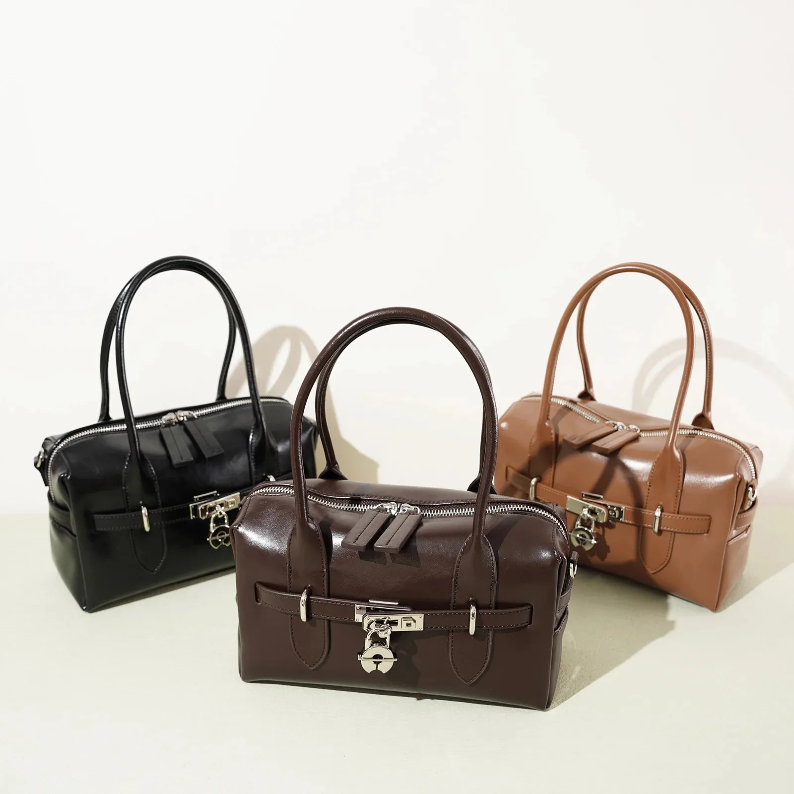 

2026 Fall Winter New Top Grain Leather Spacious Boston Bag Lock Design Single Shoulder Crossbody Pack Women Commuting Handbag