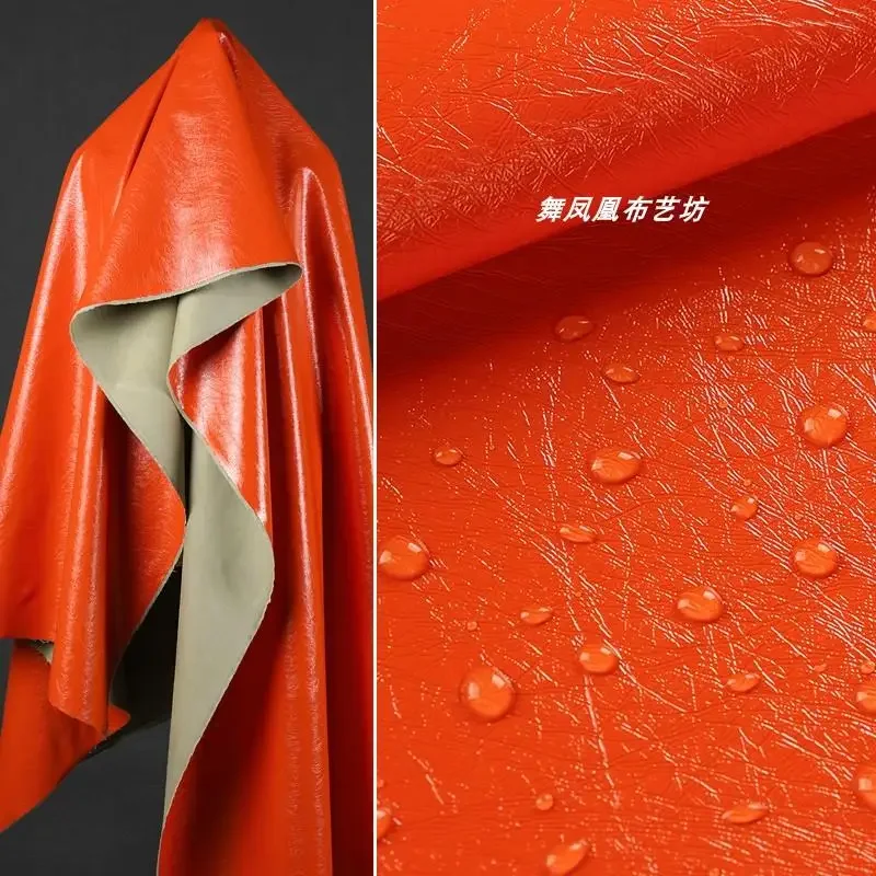 

Оранжевая глянцевая зеркальная ткань из искусственной кожи, мягкая дышащая водонепроницаемая ткань для одежды по дворам, оптовая продажа ткани «сделай сам», шить на метр